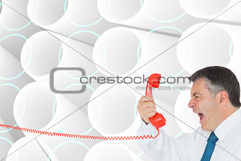 Composite image of businessman screaming directly into the hands