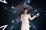 Composite image of elegant businesswoman holding black umbrella