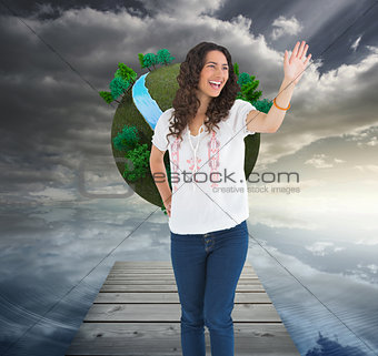 Composite image of cheerful attractive brunette smiling while gr
