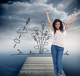 Composite image of a young happy woman stands with her hands in 