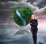 Composite image of friendly businesswoman smiling at the camera 