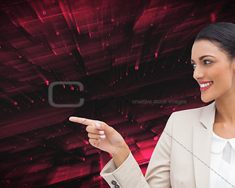 Composite image of smiling businesswoman pointing 
