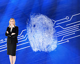 Composite image of a confident businesswoman with folded arms ag