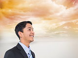 Composite image of smiling asian businessman 