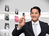 Composite image of smiling asian businessman pointing