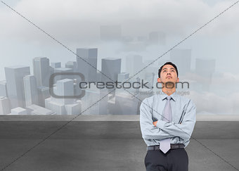 Composite image of serious asian businessman 