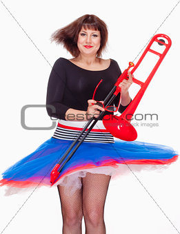 Young Female Musician with Red Trombone Dancing 