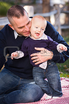 Infant Boy and Young Military Father Play in the Park