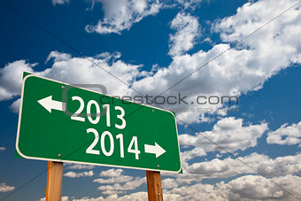 2013, 2014 Green Road Sign Over Clouds