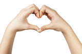 female teen hand makes heart shape with hands