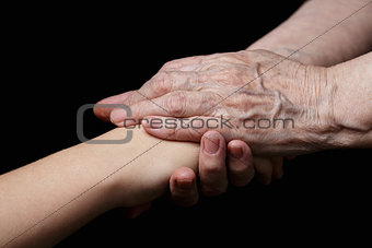 granddaughter and grandmother holding hands