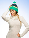 blond young woman in winter dress 