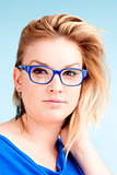 Portrait of Young Woman with Blond Hair and glasses  