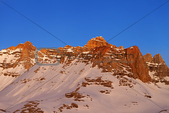 Sunrise at snowy mountains