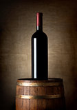 Bottle of wine on a barrel
