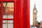 Big ben and red phone cabine. Rainy day