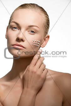 woman preparing her skin for the make-up 