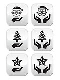 Hands with christmas buttons - santa claus, tree, star