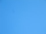 Blue clear blue sky background with little texture