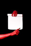 Red devil hands with black nails holding paper scroll 