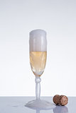 Elegant champagne glass and cork 