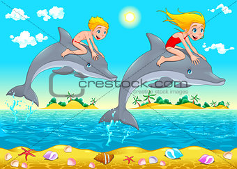 Boy, girl and dolphin in the sea.