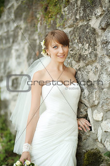 Portrait of happy cheerful smiling bride outdoors