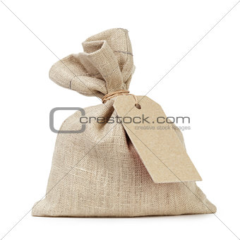 tied sack bag with paper tag