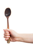 Hand holding spoon