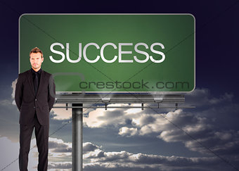 Composite image of young businessman looking at the camera