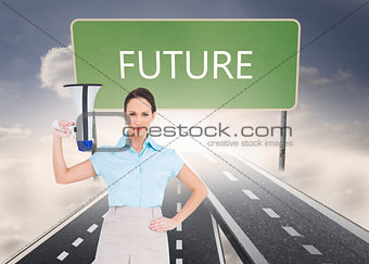 Composite image of stern classy businesswoman holding megaphone