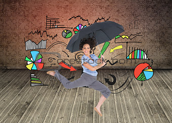 Composite image of happy classy businesswoman jumping while holding umbrella