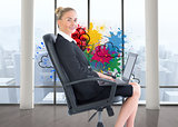 Composite image of businesswoman sitting on swivel chair with laptop