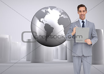 Composite image of happy businessman holding a clipboard