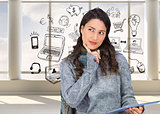 Composite image of pensive model wearing winter clothes holding her tablet
