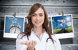 Composite image of portrait of female nurse holding out open palm