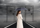 Composite image of rear view of classy businesswoman holding umbrella