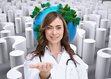 Composite image of portrait of female nurse holding out open palm