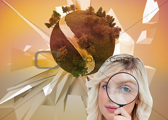Composite image of fair-haired woman looking through a magnifying glass