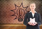 Composite image of businesswoman holding piggy bank