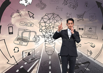 Composite image of thouhgtful asian businessman pointing