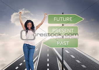 Composite image of a young happy woman stands with her hands in the air