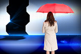 Composite image of businesswoman standing back to camera holding red umbrella