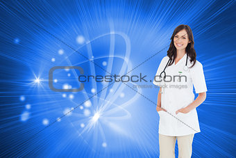 Composite image of confident and smiling woman doctor standing in front of the window