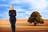 Composite image of friendly businesswoman smiling at the camera in a meeting