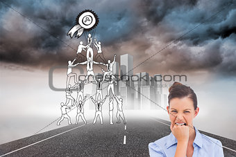Composite image of furious businesswoman looking at the camera