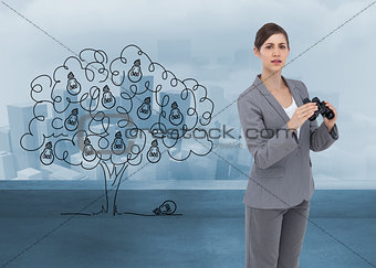 Composite image of curious young businesswoman posing with binoculars