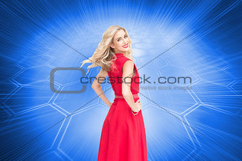 Composite image of smiling blonde turning