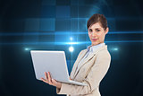 Composite image of confident young businesswoman with laptop