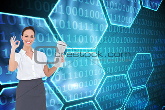 Composite image of stylish businesswoman making gesture while holding newspaper